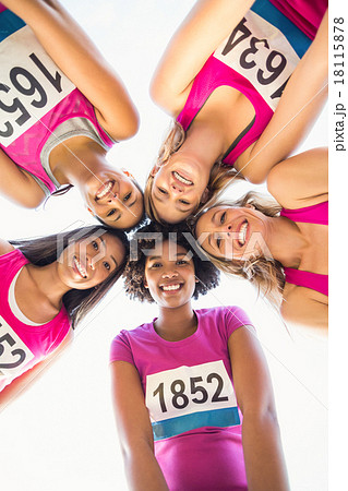 Five smiling runners supporting breast cancer marathon Five smiling runners supporting breast cancer marathon 18115878