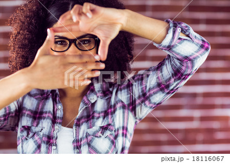 Attractive hipster taking picture with hands 18116067