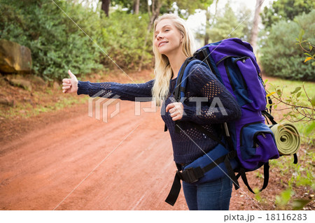 Pretty hitchhiker sticking thumb out Pretty hitchhiker sticking thumb out 18116283
