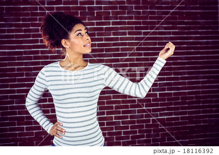 Young woman gesturing 18116392