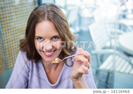 Pretty brunette enjoying chocolate dessert Pretty brunette enjoying chocolate dessert 18116468