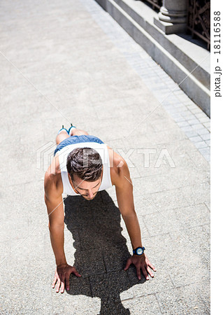 Handsome athlete doing push ups 18116588