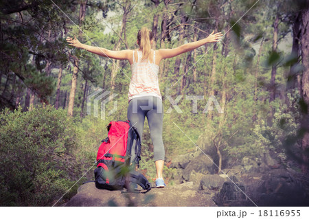 Carefree blonde hiker with arms outstretched 18116955