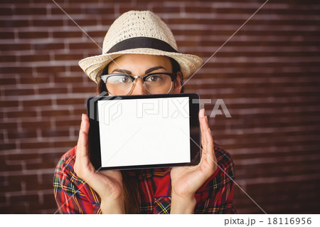 Beautiful hipster showing tablet to camera 18116956