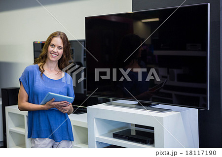 Pretty woman shopping for new television 18117190