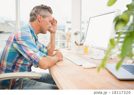 Frustrated casual designer using computer Frustrated casual designer using computer 18117320