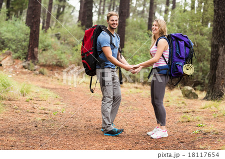Young happy hiker couple holding hands Young happy hiker couple holding hands 18117654