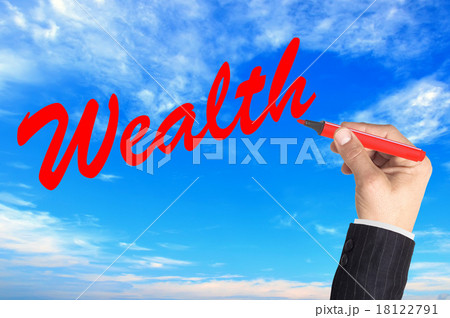 Hand writing word Wealth over blue sky background 18122791