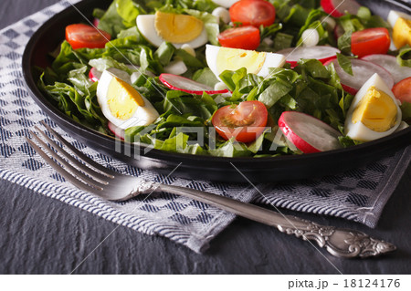 salad with eggs, radishes and sorrel close up 18124176