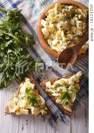 bread and egg salad close-up. Vertical top view bread and egg salad close-up. Vertical top view 18124350