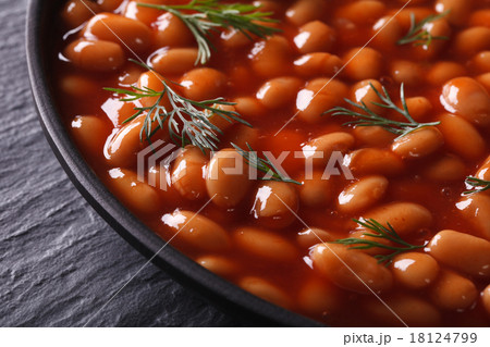 white beans in tomato in a black bowl close-up white beans in tomato in a black bowl close-up 18124799