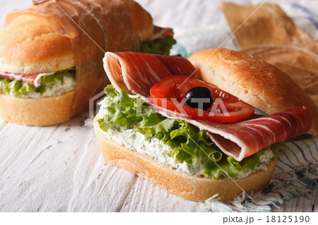 Sandwiches with ham, cream cheese and vegetables 18125190