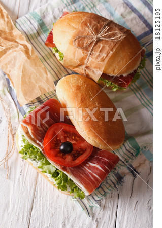 Sandwiches with prosciutto and vegetables top view 18125195