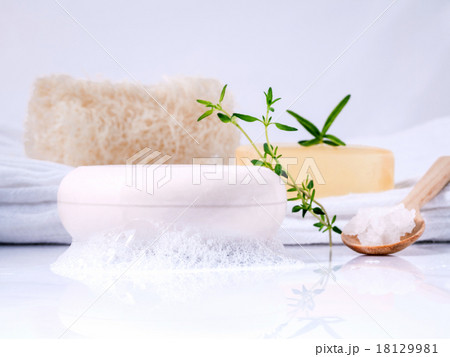 Herbal spa soap bar on white bath towel . Herbal spa soap bar on white bath towel . 18129981