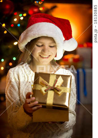 excited girl looking inside of magic present box excited girl looking inside of magic present box 18130885
