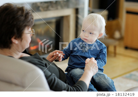 Grandmother and granddaughter playing together 18132419