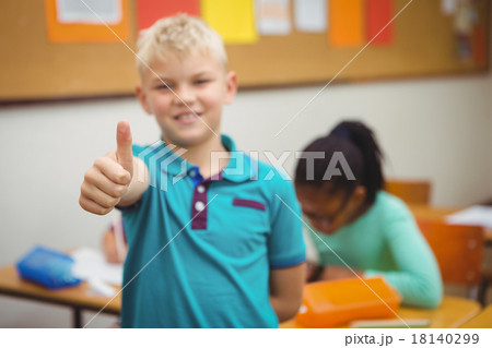 Smiling student with thumbs up Smiling student with thumbs up 18140299