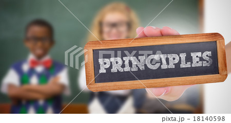 Principles against pupils smiling at camera with arms crossed Principles against pupils smiling at camera with arms crossed 18140598