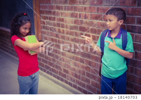 Upset child being teased by another child Upset child being teased by another child 18140703
