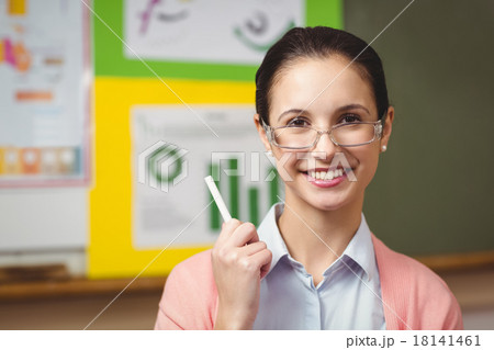 Teacher smiling at camera in classroom 18141461