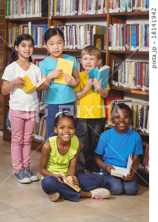 Smiling pupils with books in the library Smiling pupils with books in the library 18141942