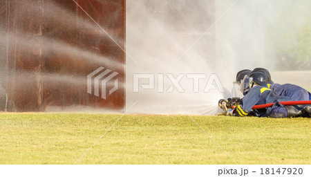 Firefighter fighting for fire attack training Firefighter fighting for fire attack training 18147920