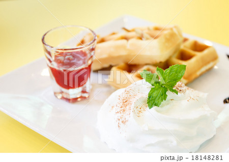 Strawberry Waffle whipped Cream on yellow desk Strawberry Waffle whipped Cream on yellow desk 18148281