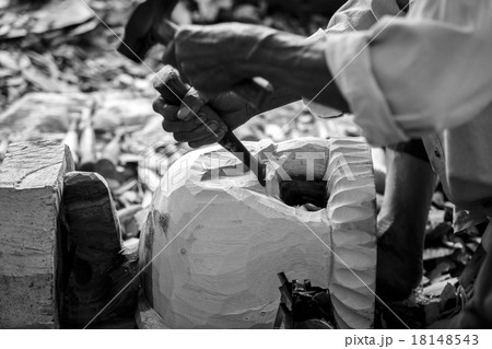 Hand of carver carving wood in black and white color tone Hand of carver carving wood in black and white color tone 18148543