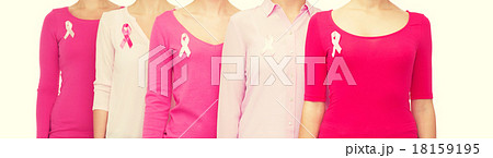 close up of women with cancer awareness ribbons 18159195