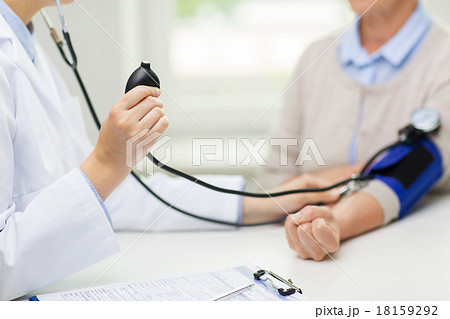 doctor with tonometer and senior woman at hospital doctor with tonometer and senior woman at hospital 18159292