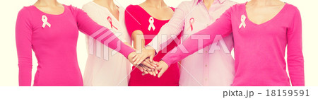 close up of women with cancer awareness ribbons 18159591