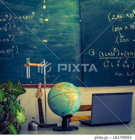 laptop and globe on table of teacher ( Filtered image processed laptop and globe on table of teacher ( Filtered image processed 18170093