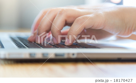 Closeup of business woman hand typing on laptop keyboard Closeup of business woman hand typing on laptop keyboard 18170427