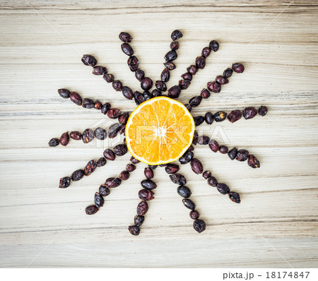 Happy sun made of rosehips and orange 18174847