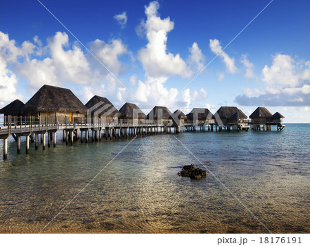 Typical Polynesian landscape -small houses on wate Typical Polynesian landscape -small houses on wate 18176191