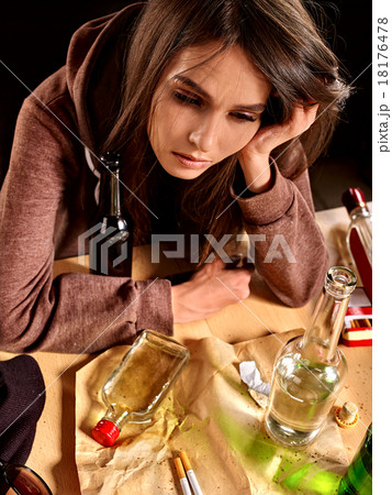 Girl in depression drinking alcohol. Girl in depression drinking alcohol. 18176478