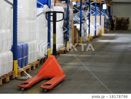 Orange pallet truck for package in the warehouse Orange pallet truck for package in the warehouse 18178796