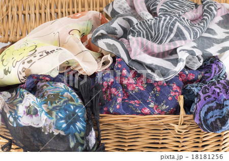 Woman scarf in a wooden basket Woman scarf in a wooden basket 18181256