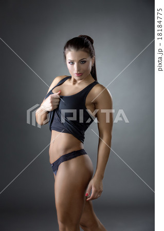 Hot athletic woman invitingly looking at camera 18184775