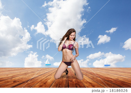 Young pretty woman posing on the pier. Young pretty woman posing on the pier. 18186026