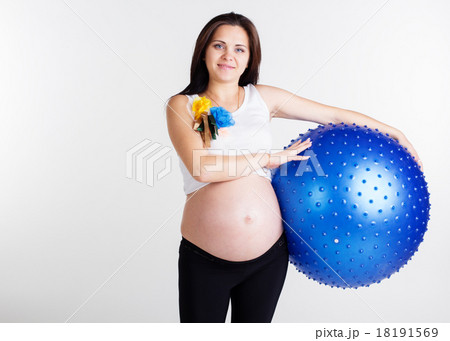 Pregnant girl is holding fitball 18191569