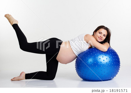 Pregnant girl doing fitness exercises with fitball Pregnant girl doing fitness exercises with fitball 18191571