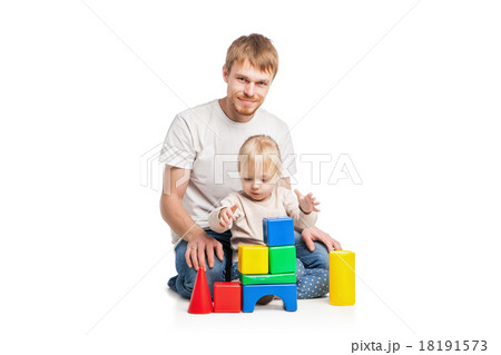 Baby girl building from toy blocks with her father Baby girl building from toy blocks with her father 18191573