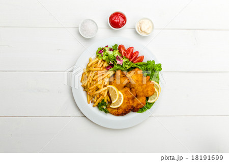 Chicken cutlets with fries and salad 18191699