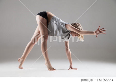 young beautiful woman in grey T-shirt and black 18192773