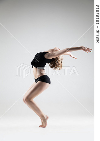 young beautiful woman in black T-shirt and shorts 18192813