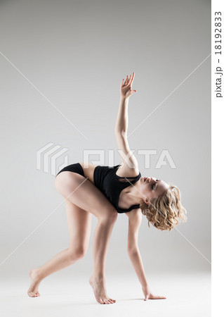 young beautiful woman in black T-shirt and shorts 18192833