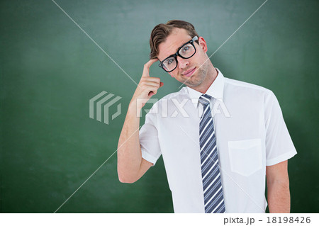 Composite image of geeky businessman thinking with finger on tem 18198426