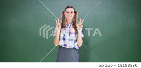 Composite image of geeky hipster smiling at camera 18198830