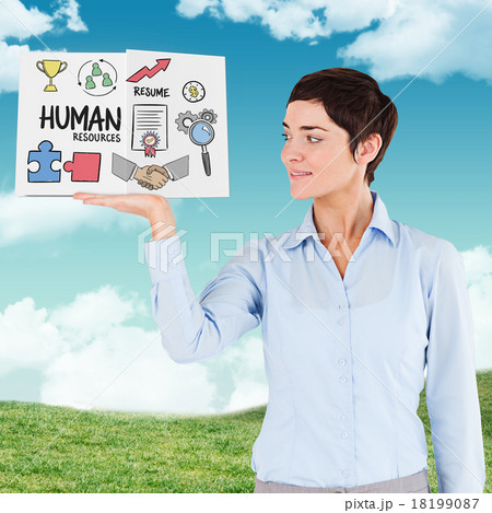 Composite image of businesswoman showing a book 18199087
